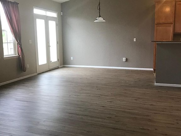New flooring-light, airy great room with patio