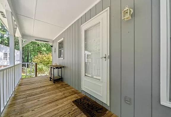 Storm door included. Large, porch with lots of space for plants and/or chairs.