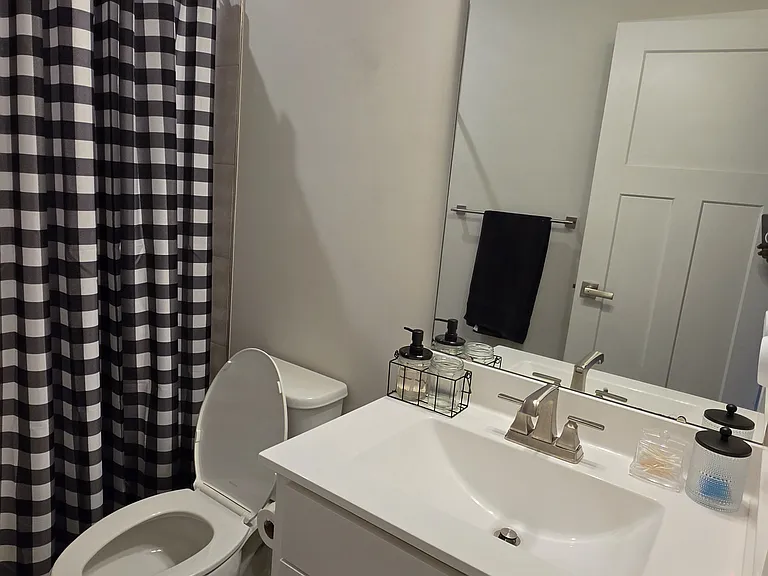 Third level shared bathroom and shower.