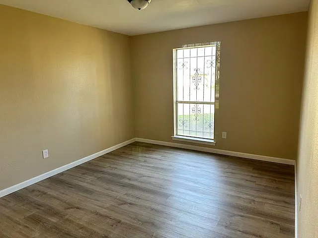 2nd bedroom features wood flooring, large closet space, and privacy door to 2nd bath.