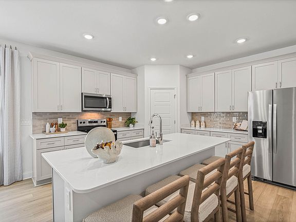 Kitchen in the Newport floorplan at a Meritage Homes community in Gulfport, MS.