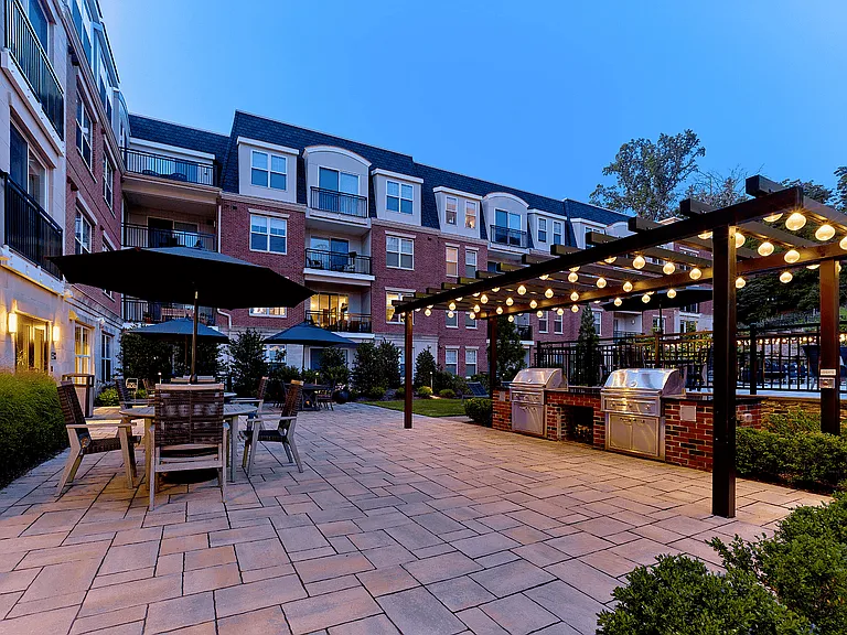 Experience our outdoor amenities at its finest in this beautifully lit courtyard, perfect for entertaining and relaxation.