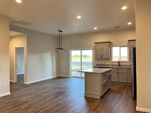 open concept living room/kitchen/dining room