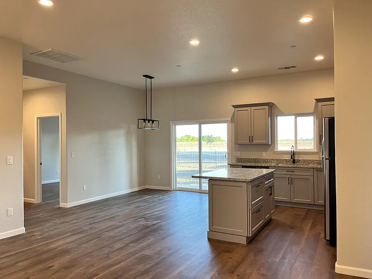 open concept living room/kitchen/dining room