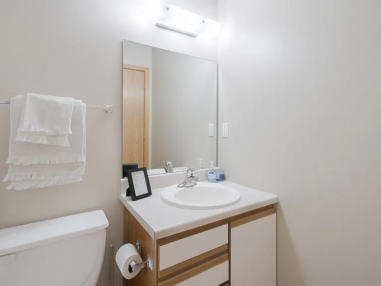 Our bathrooms are designed with simplicity and functionality, featuring ample storage space and bright lighting.