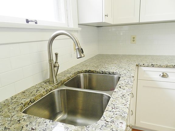 Faucet has built in sprayer and extra deep undermount sink