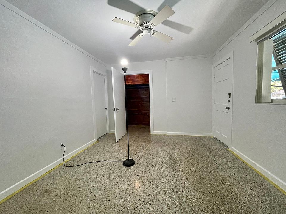 Bedroom with cedar lined closet and ceiling fan