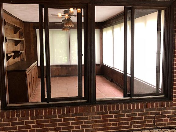 Looking into sun porch from family/great room has been used as tv/office space. Faces side & back of house. Large walk in storage closet .Newly installed windows. Solar shades.