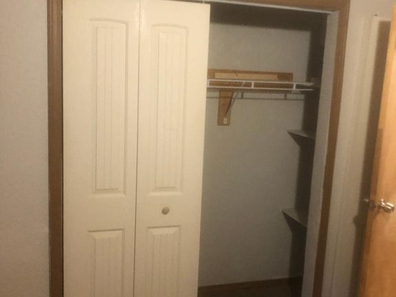 Downstairs bedroom #2, with closet shown. The other door will be put back on. Measurements are in the description.