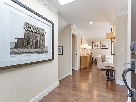 Welcoming foyer leads to living area ahead and to the right, the kitchen/dining room