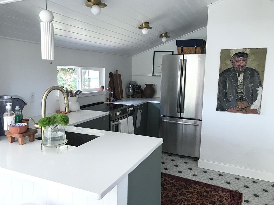 Lots of storage in kitchen with full-sized refrigerator with automatic ice maker and brand new appliances