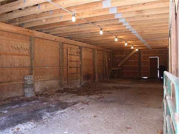Barn. Space for tack or feed storage on the first floor of the barn across from the stalls.