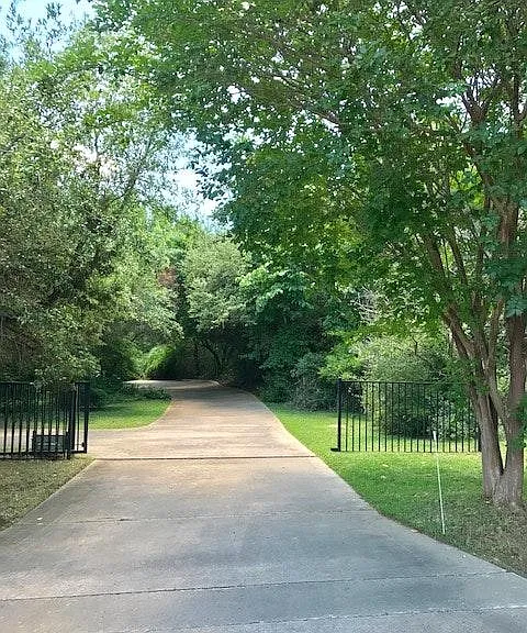Private and secluded wooded setting on over an ACRE