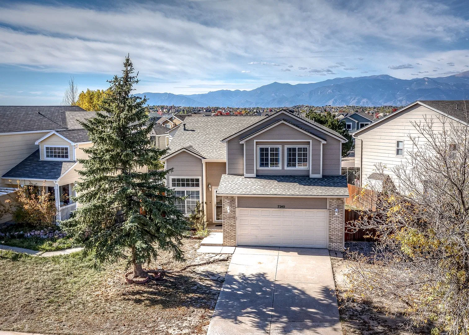 Spacious 4-Bed Home with Finished Basement| Pikes Peak Views — Photo 1