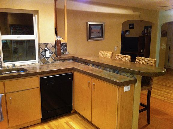Kitchen-Concrete Countertops (My husband poured the countertops), Dishwasher and gas range.