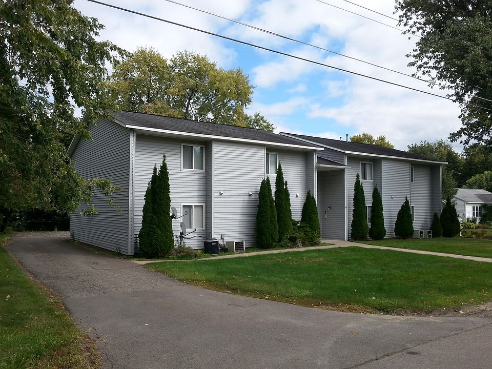 Attractive Front of Building with driveway to parking lot in the rear