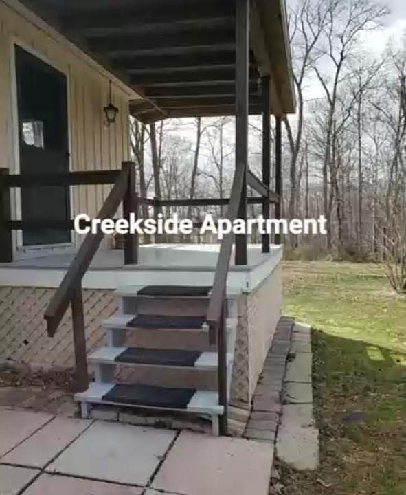 Creekside Apartment with deck and storage under the deck.