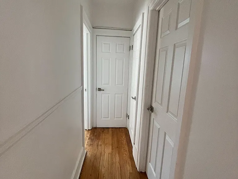 Hallway to bedroom, linen closet, basement, bathroom