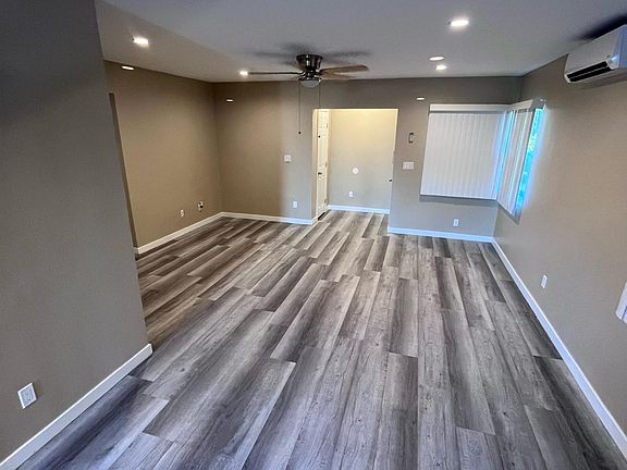 Living room with ceiling fan.