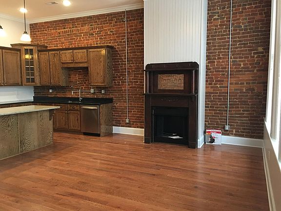 Open concept living room and kitchen. Gas fireplace with antique mantel. Real oak hardwood floors.