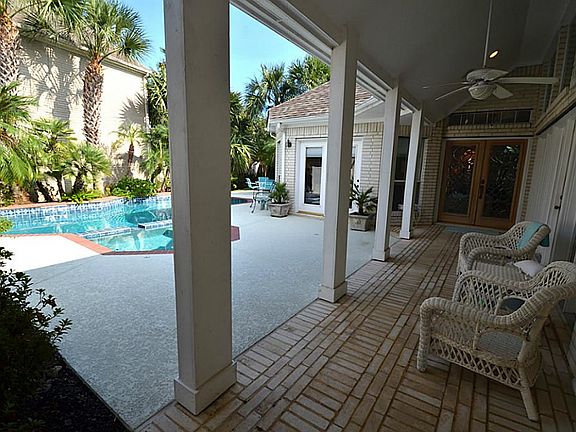 Entry way past the Guest House through a secured gate. Perfect area for enjoying the pool but protection from the sun.