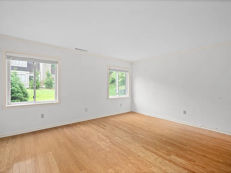 Main level primary bedroom with en suite, large closet and privacy