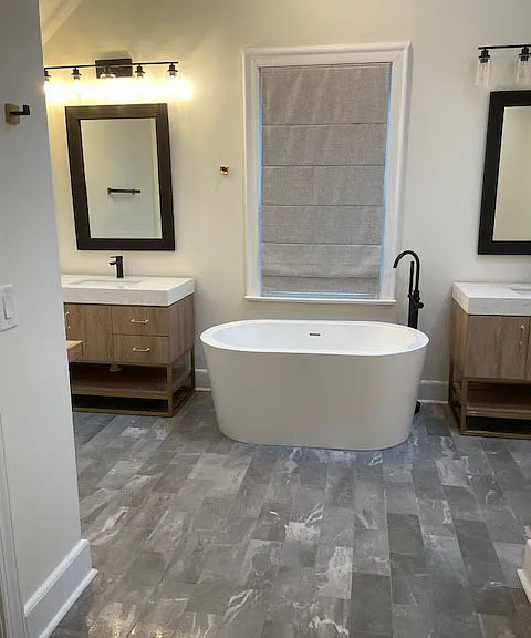 Master bath Soaking tub with two vanities