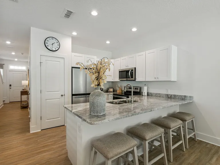 Kitchen with eat in bar with stools