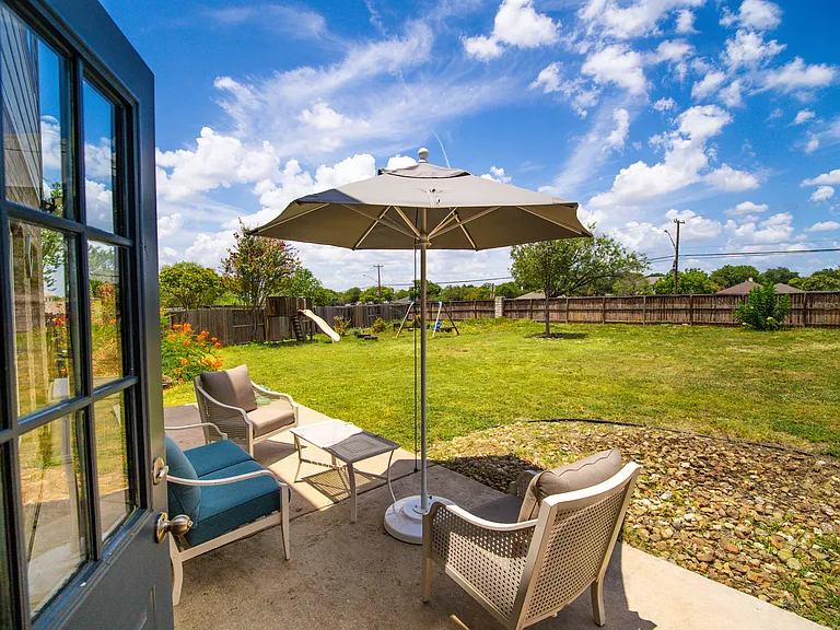 Private Patio Oasis: Step out from the dining area onto your concrete patio. It's an ideal spot for outdoor dining, grilling, or lounging while looking out over the massive yard.