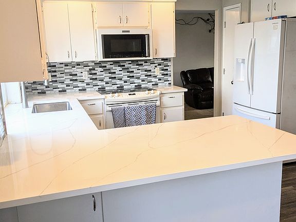 Kitchen with new Quartz countertop and sink