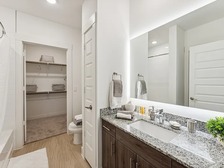 Unwind in beautifully appointed bathrooms that combine comfort and style at Latitude Apartments