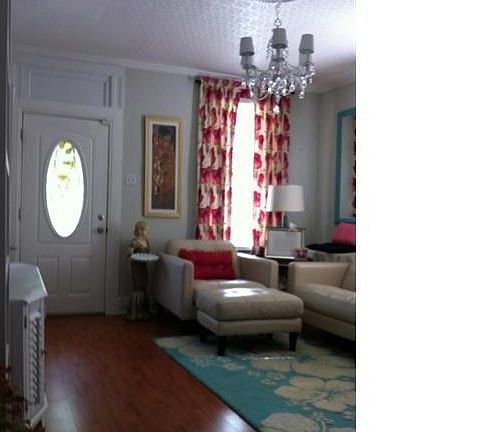 Large Formal Living Room with a casual atmosphere, Pergo wood flooring extends into Dining Room, newer windows.  Chandelier negotiable.