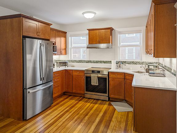 Eat-in kitchen with brand new cabinets, countertop, and stainless steel appliances