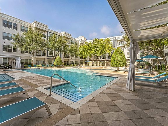 Enjoy luxury living with our stunning resort-style pool at Addison Keller Springs in Addison, TX