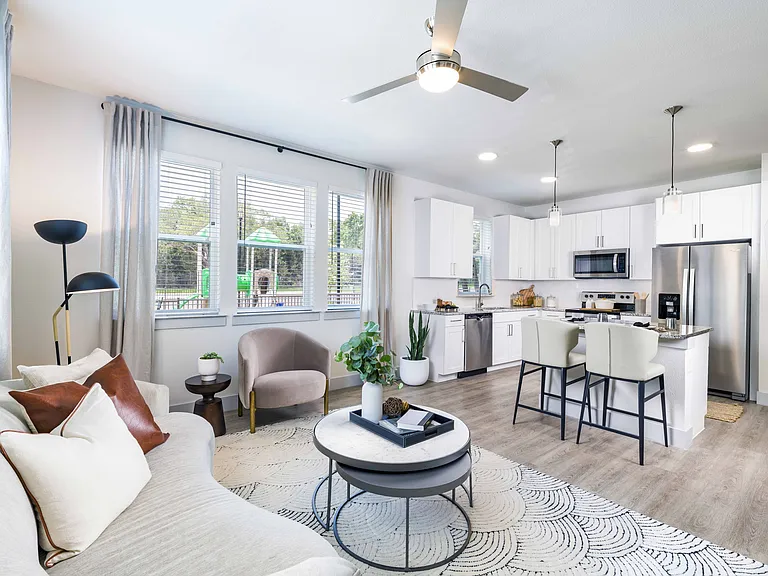 Indulge your culinary passions in style at Modera Georgetown's gourmet kitchen, featuring granite countertops, sleek shaker white cabinetry with satin pulls, and elegant under-cabinet lighting.