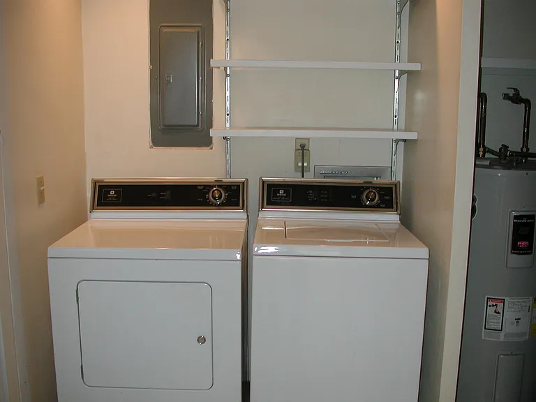 Washer, dryer, some storage, hot water tank