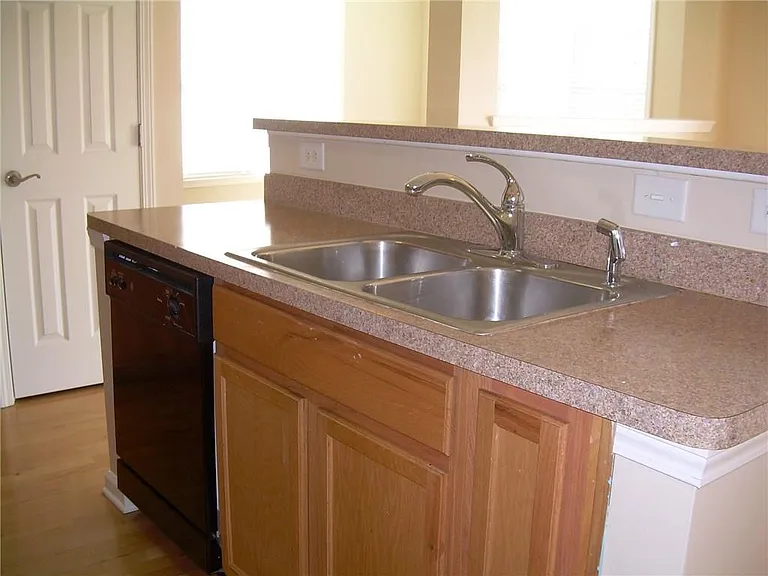 1975 Nocturne Drive
View of kitchen island.
Note: The back splash area is now checkered tiles.