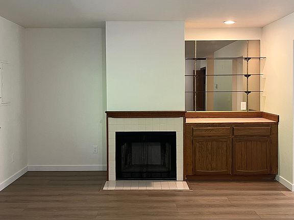 Living room with fireplace and bar