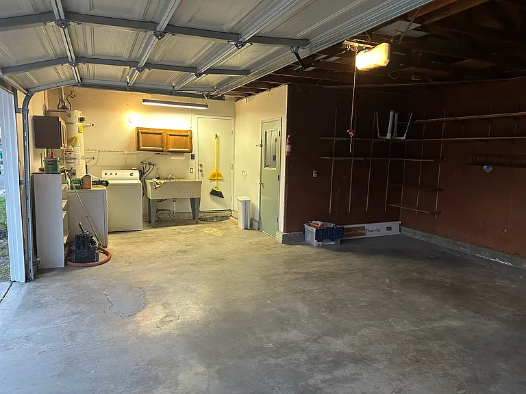 Oversize Garage/ laundry area with sink.