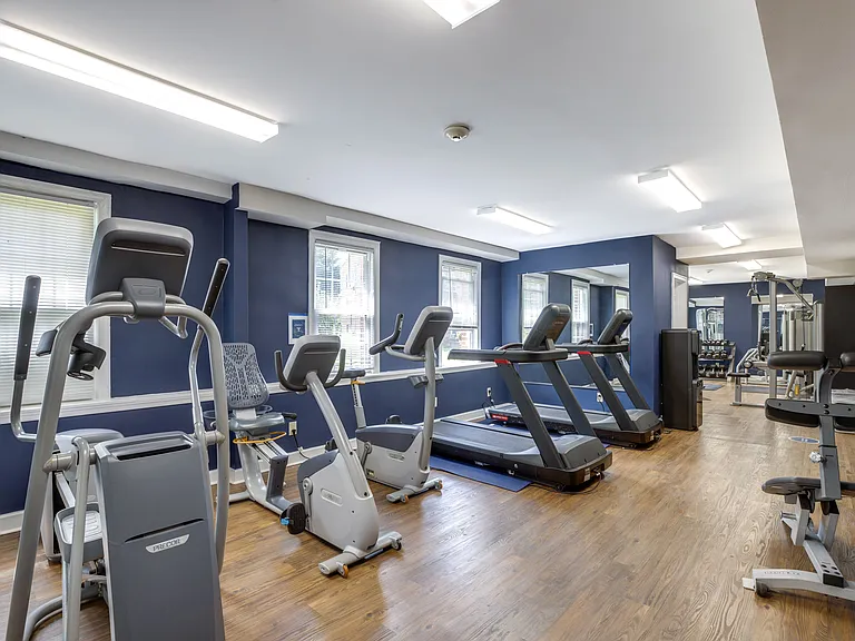 a gym with cardio equipment and treadmills at Park Crest Apartments, District of Columbia 20007