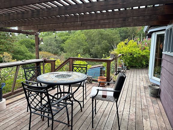 wraparound porch, rear yard and orchard