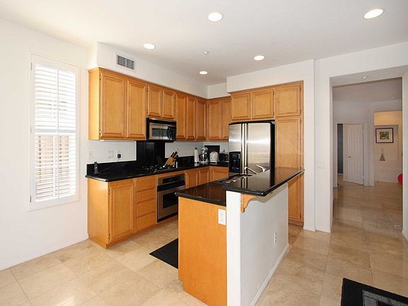 Kitchen with Granite Counters and Breakfast Bar