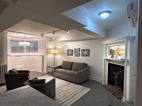 Bay window area, typical of the DC Victorian townhouses, graces the living area. (Table and chairs coming soon!)