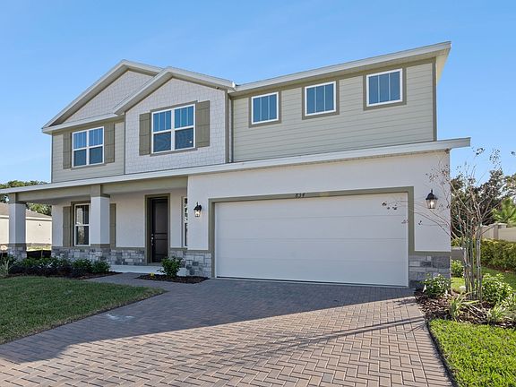 3 Car Tandem Garage with Paver Driveway and Leadwalk