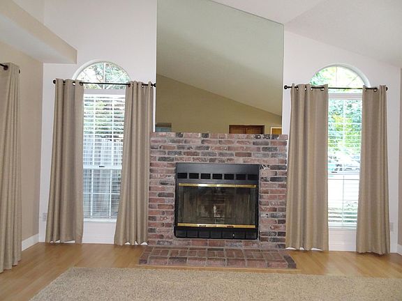 Fireplace with blower.  Floor to ceiling windows on either s