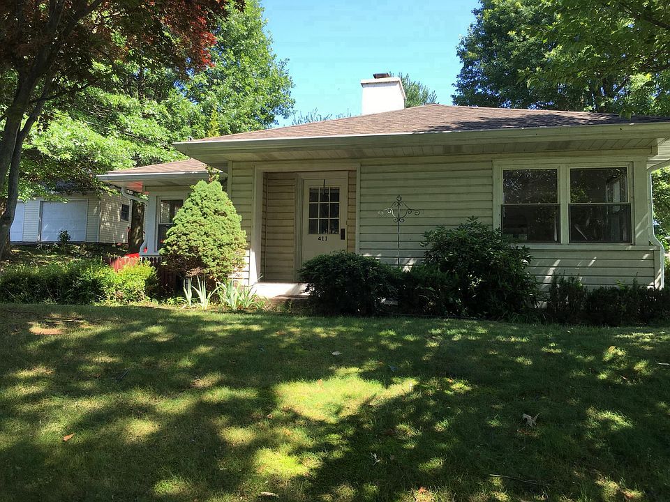 Street view - large open lot to left, Deck area behind house