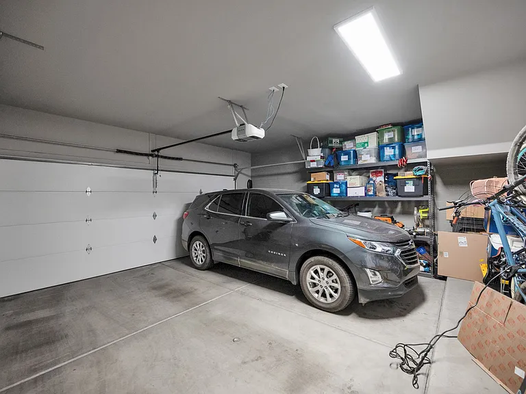 Large garage easily fits two vehicles and storage