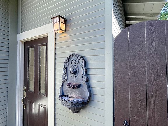 Front Door, Fountain, & Outdoor Storage