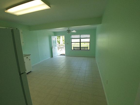 Kitchen/Livingroom view toward lake front back deck