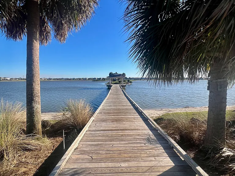 FISHING DOCK WITH VIEW OF ISLANDS IN MIDDLE OF LAKE ALSO BOATRAMP